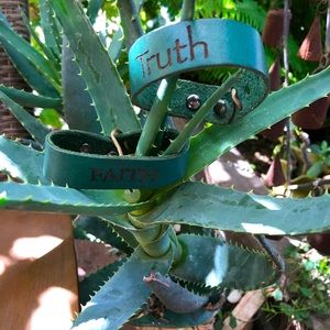 Leather bracelets with words “Truth” and “Faith”
